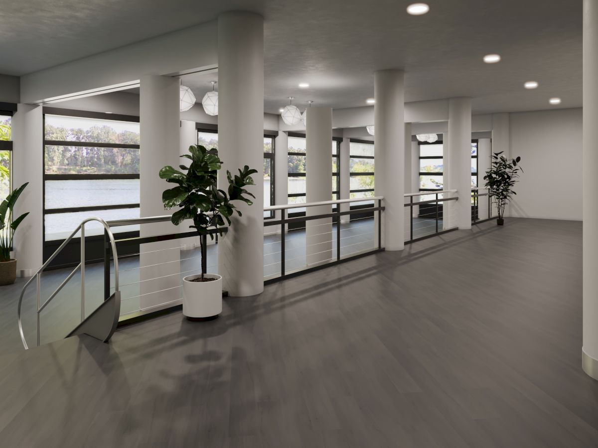 A modern interior with large windows, potted plants, columns, and overhead lighting, creating an open and airy atmosphere.